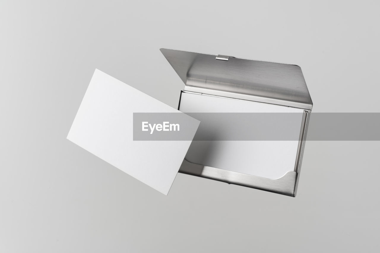 Business card holder against gray background