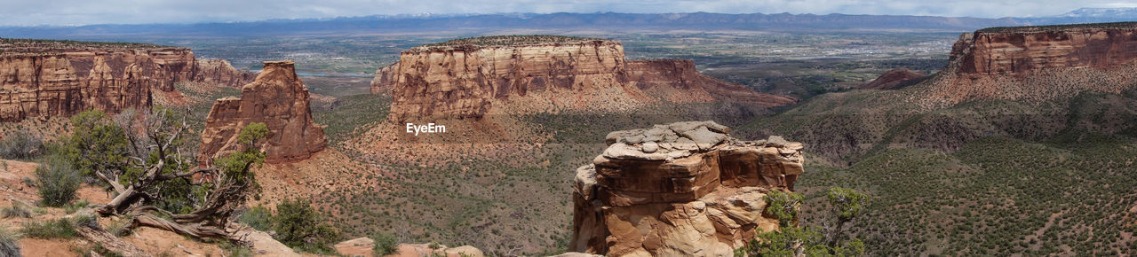 Panoramic view of rock formations against sky