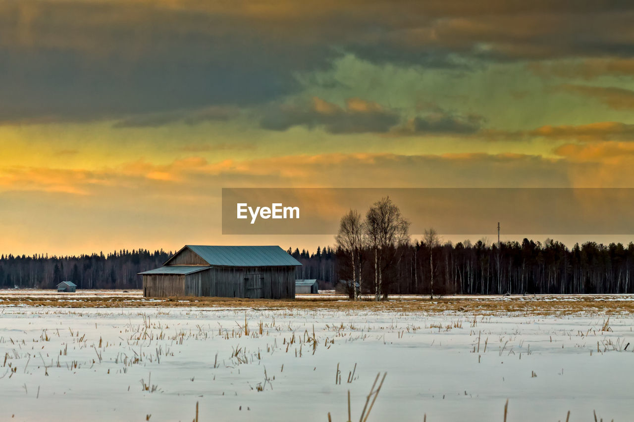 House against sky during sunset