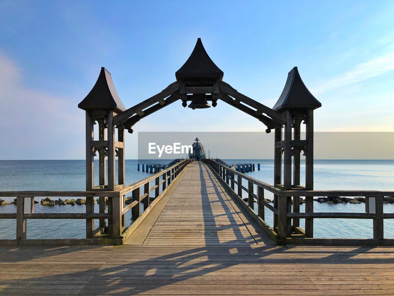 Pier over sea against sky