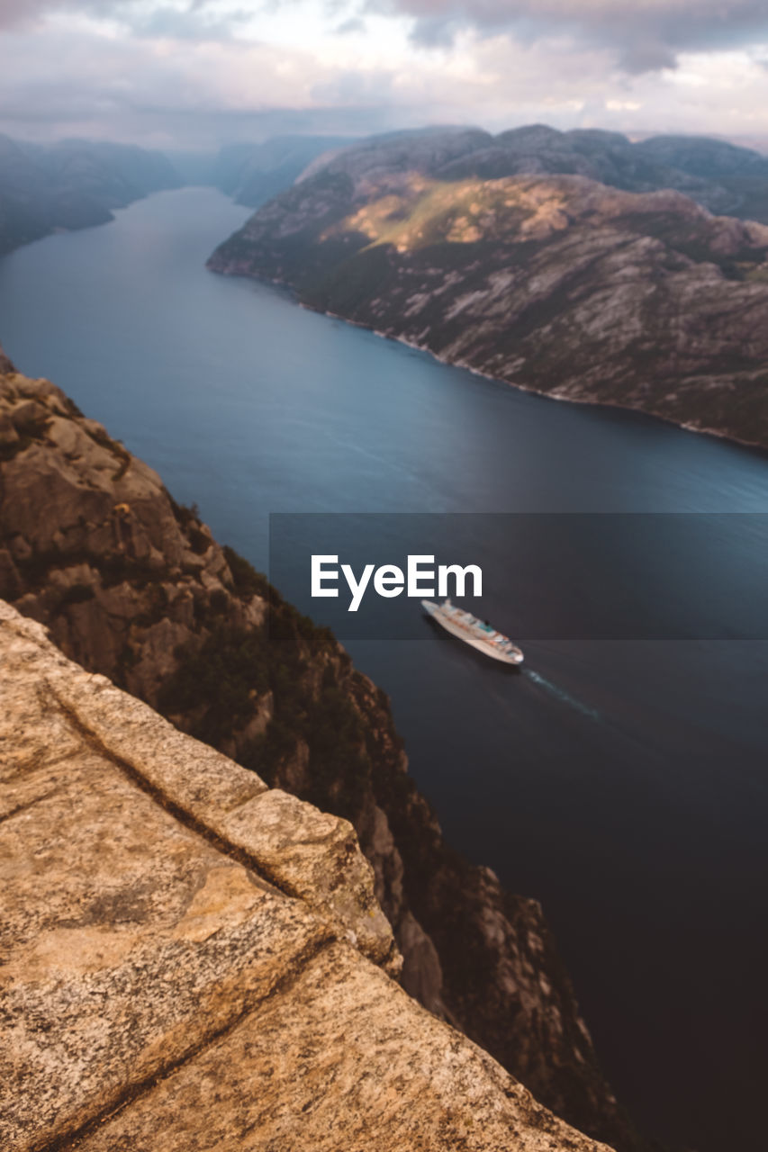 Top view of cruise ship cruising between the fjords in norway