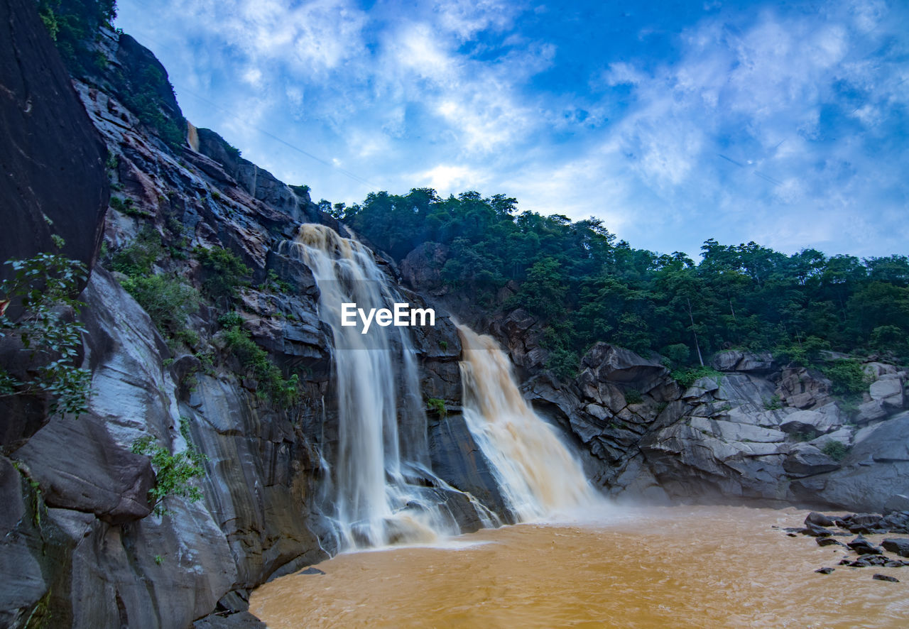 waterfall, environment, scenics - nature, water, beauty in nature, nature, landscape, body of water, land, travel destinations, travel, rock, sky, motion, cloud, tourism, social issues, water feature, environmental conservation, tropical climate, forest, tree, river, outdoors, plant, blue, long exposure, mountain, no people, trip, holiday, vacation, cliff, fog, non-urban scene, flowing, rock formation, activity, power in nature, flowing water, stream, adventure