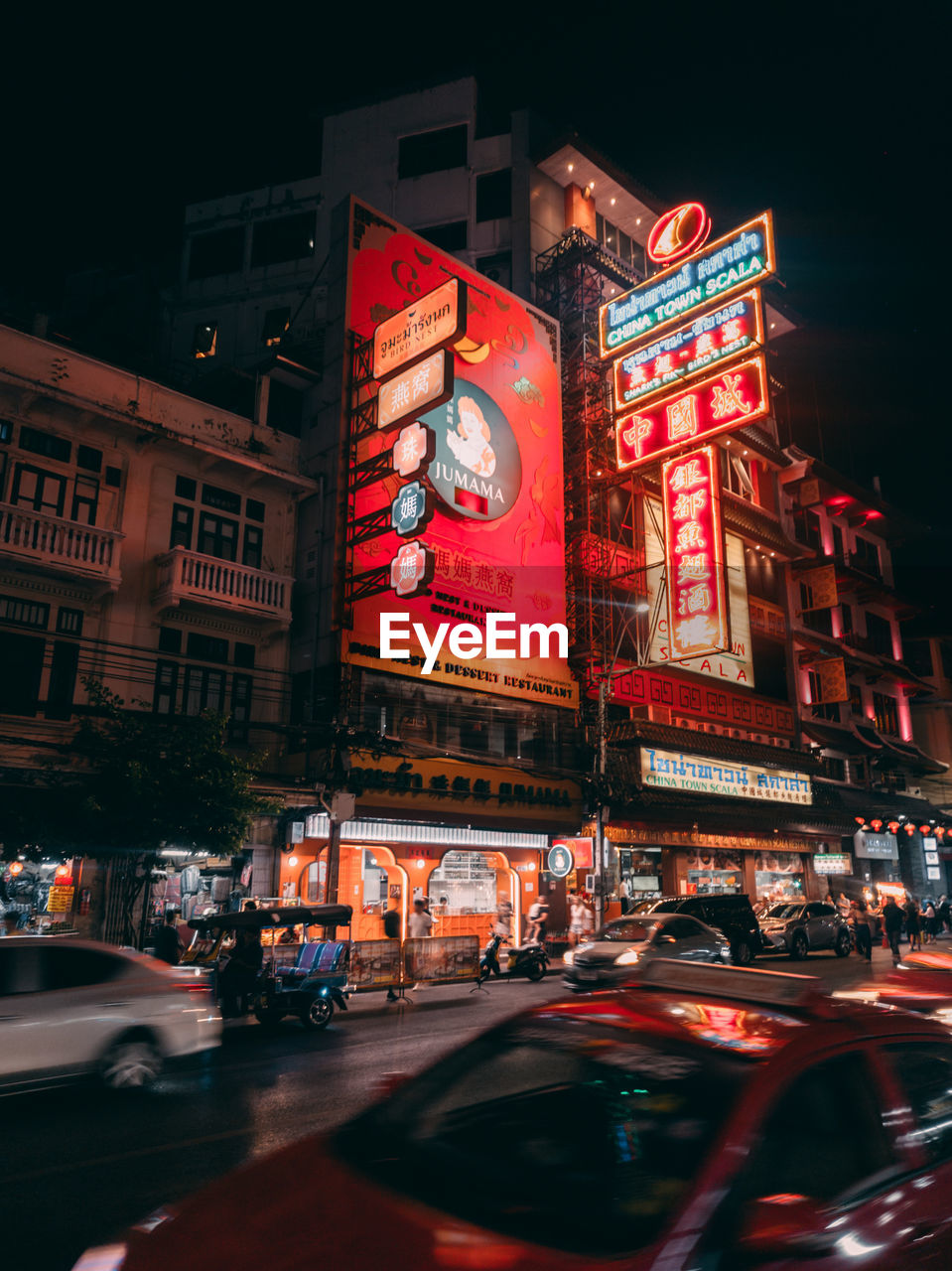 Illuminated city street at night