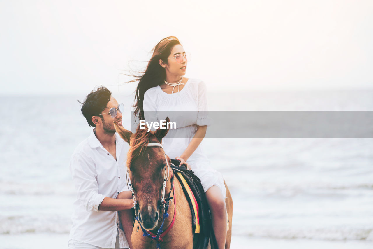 YOUNG COUPLE ON BEACH