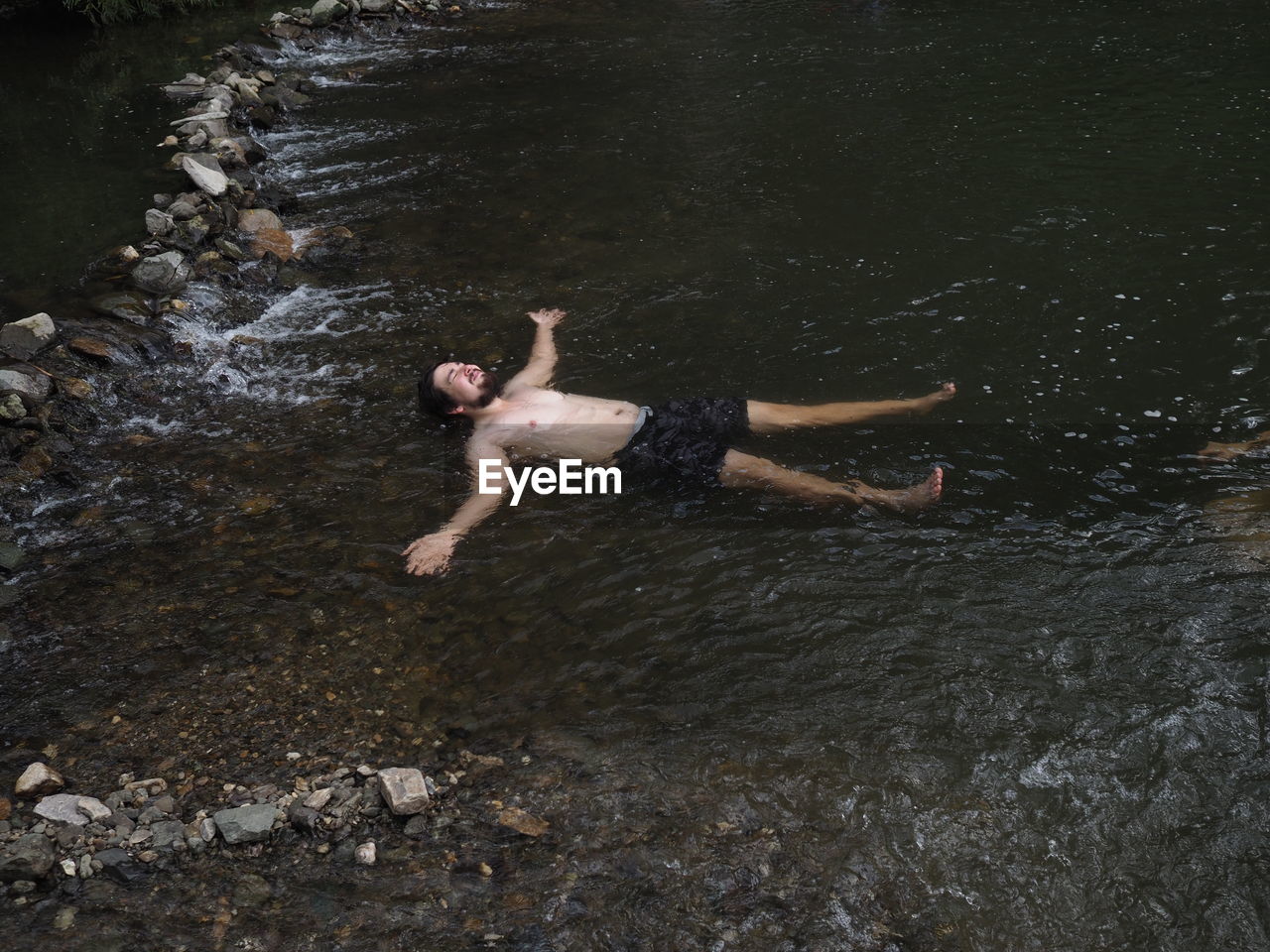 High angle view of man swimming in lake