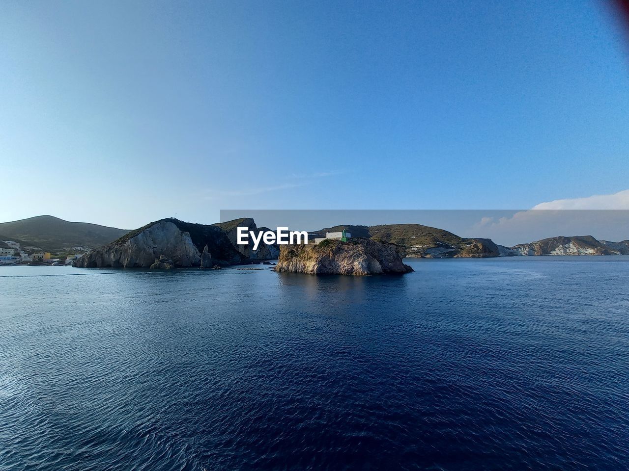 PANORAMIC SHOT OF SEA AGAINST CLEAR BLUE SKY