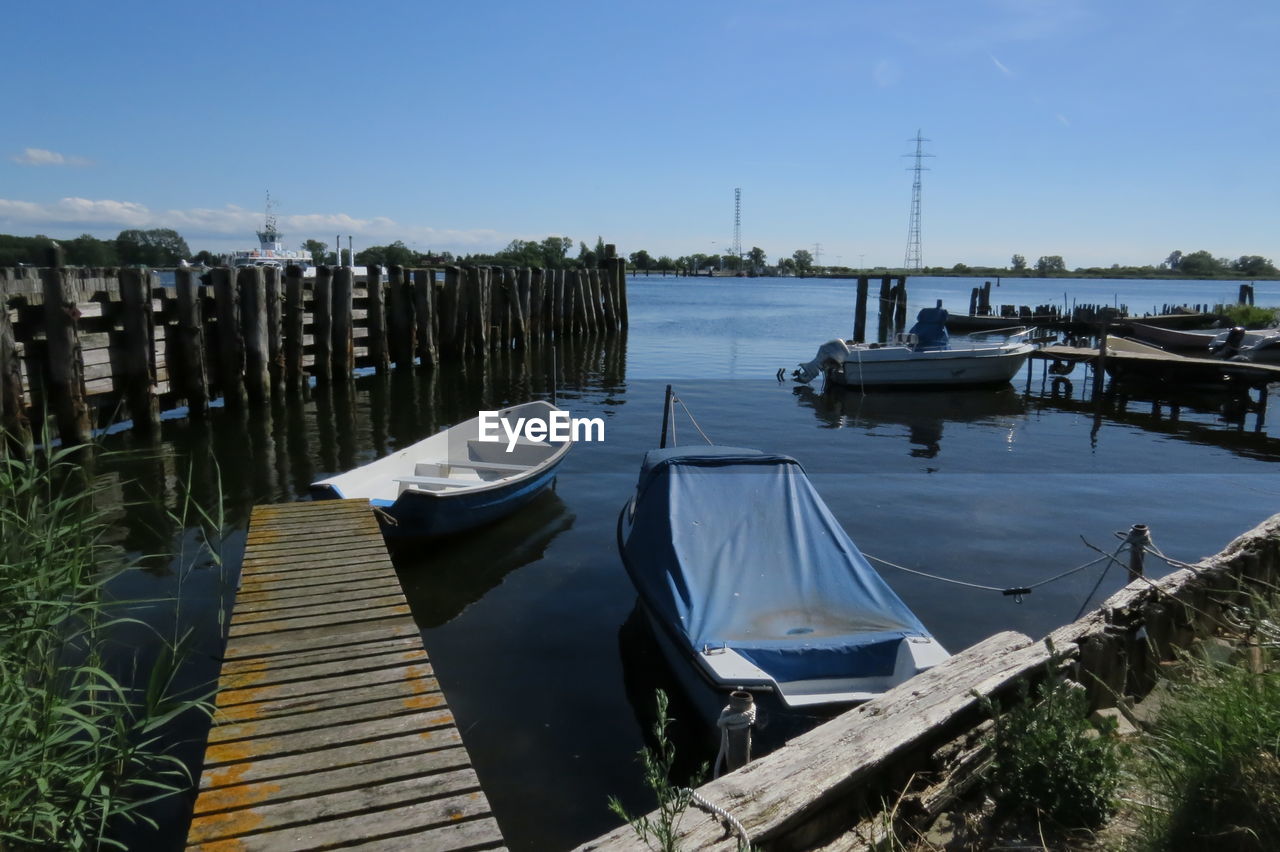 Boats moored at harbor