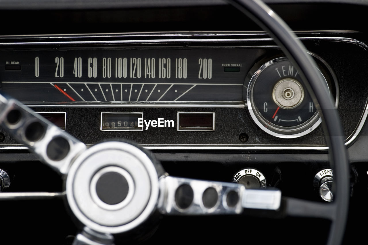 Close-up of steering wheel of vintage car