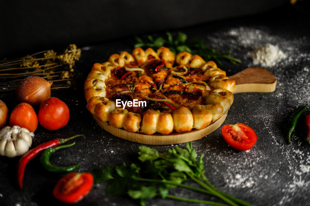 Baked meal with ingredients on table