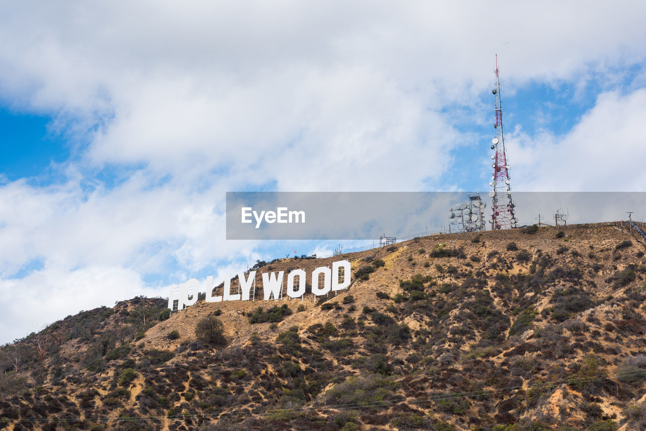 LOW ANGLE VIEW OF COMMUNICATIONS TOWER AGAINST SKY