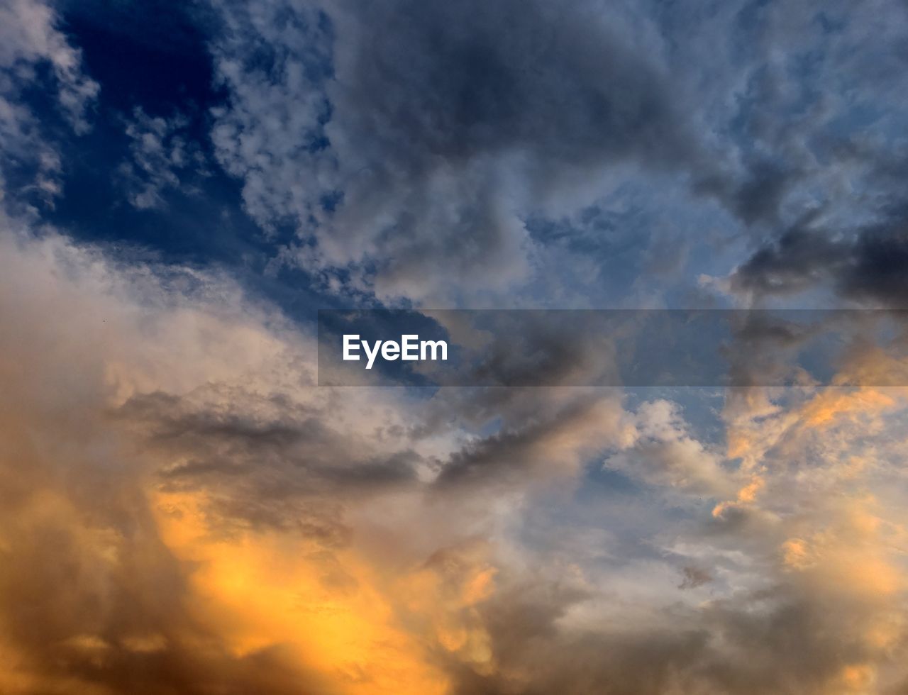 Low angle view of dramatic sky during sunset