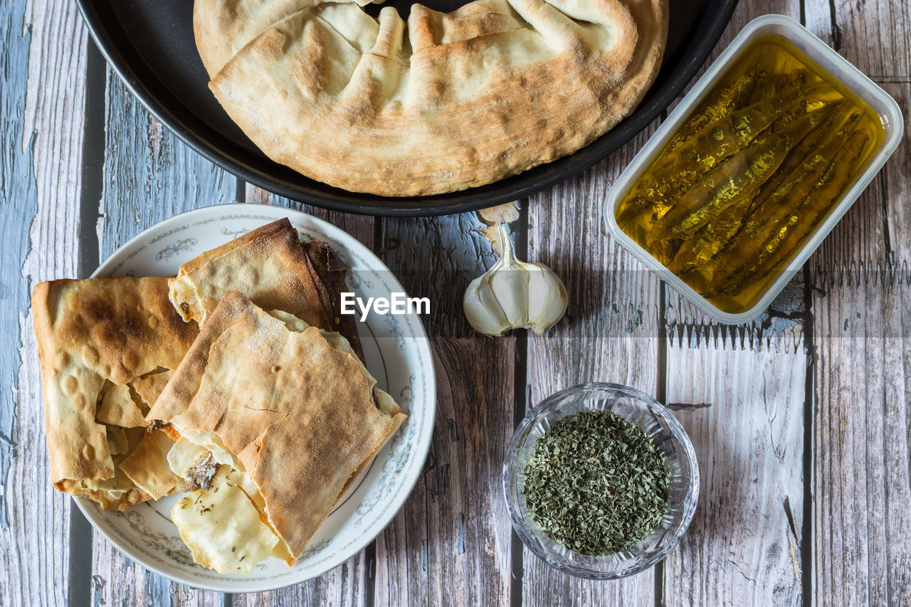 Pizza puff with anchovies. traditional peasant dish.