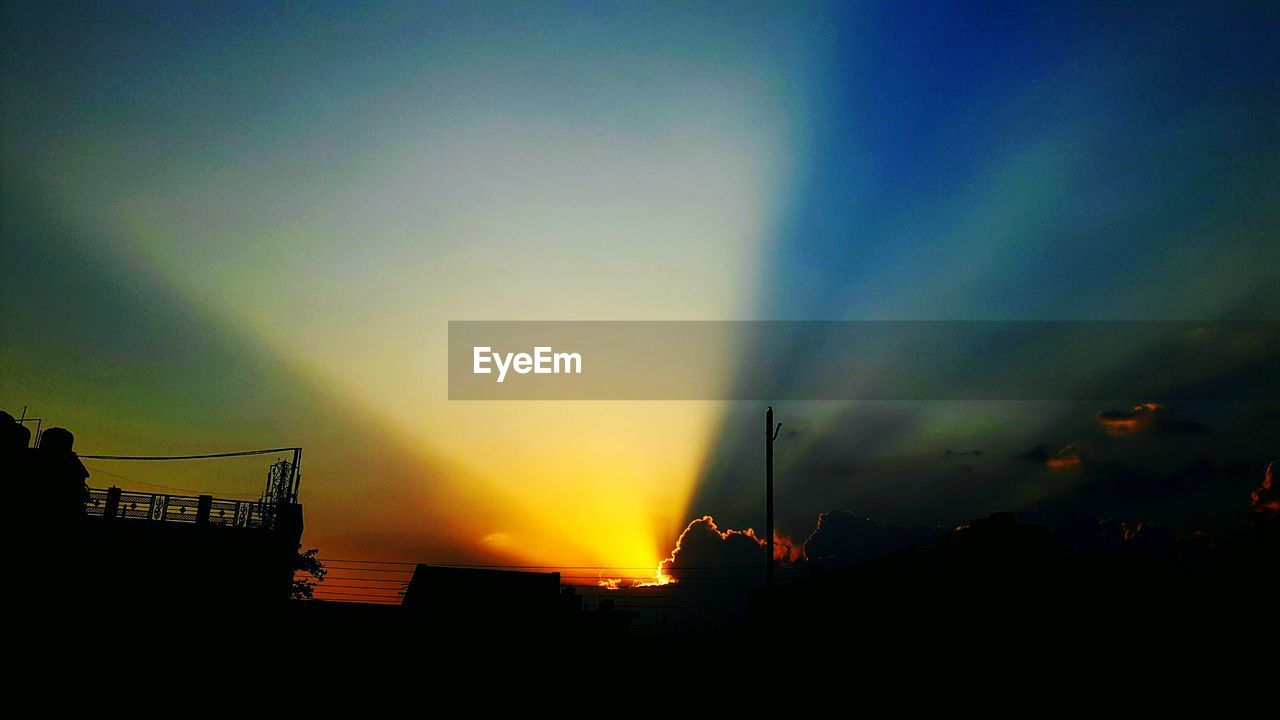Low angle view of dramatic sky during sunset