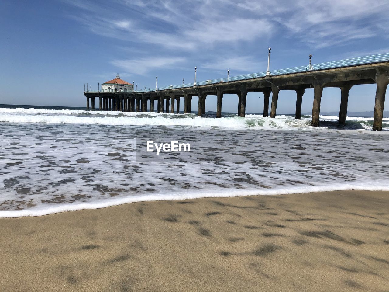 Pier over sea against sky