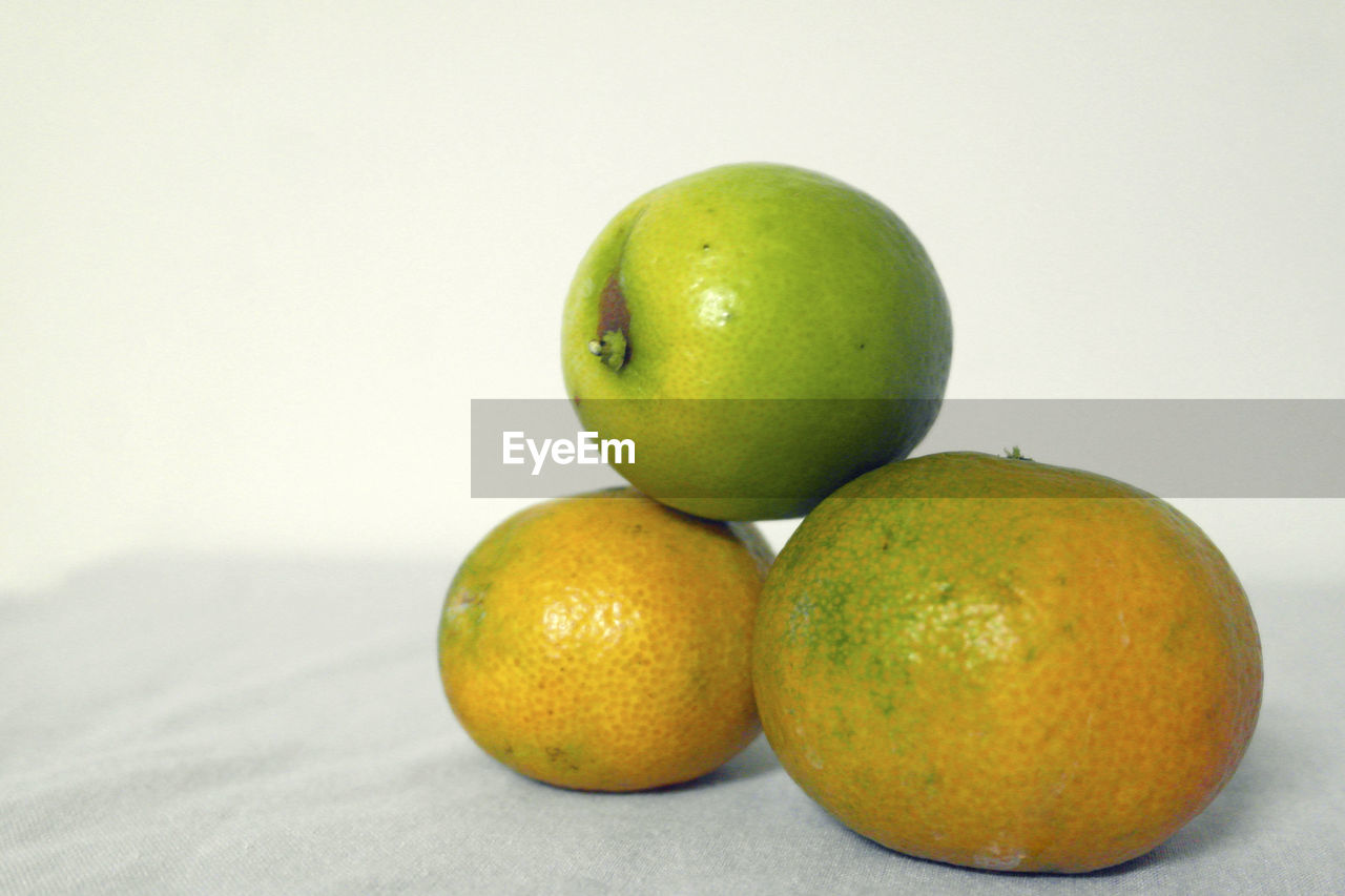 CLOSE-UP OF FRUITS IN CONTAINER