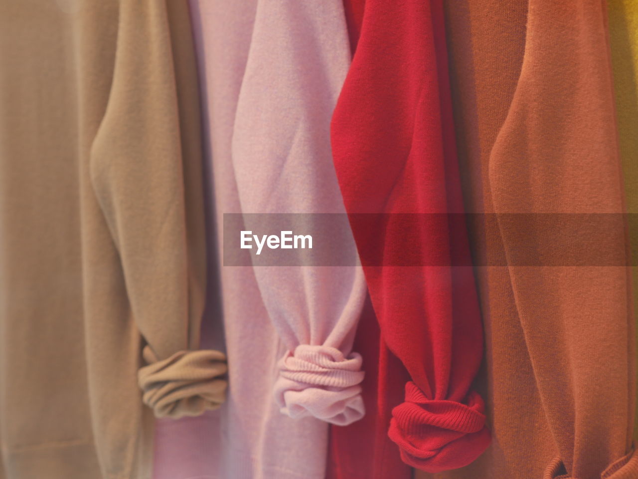 Close-up of clothes hanging in store