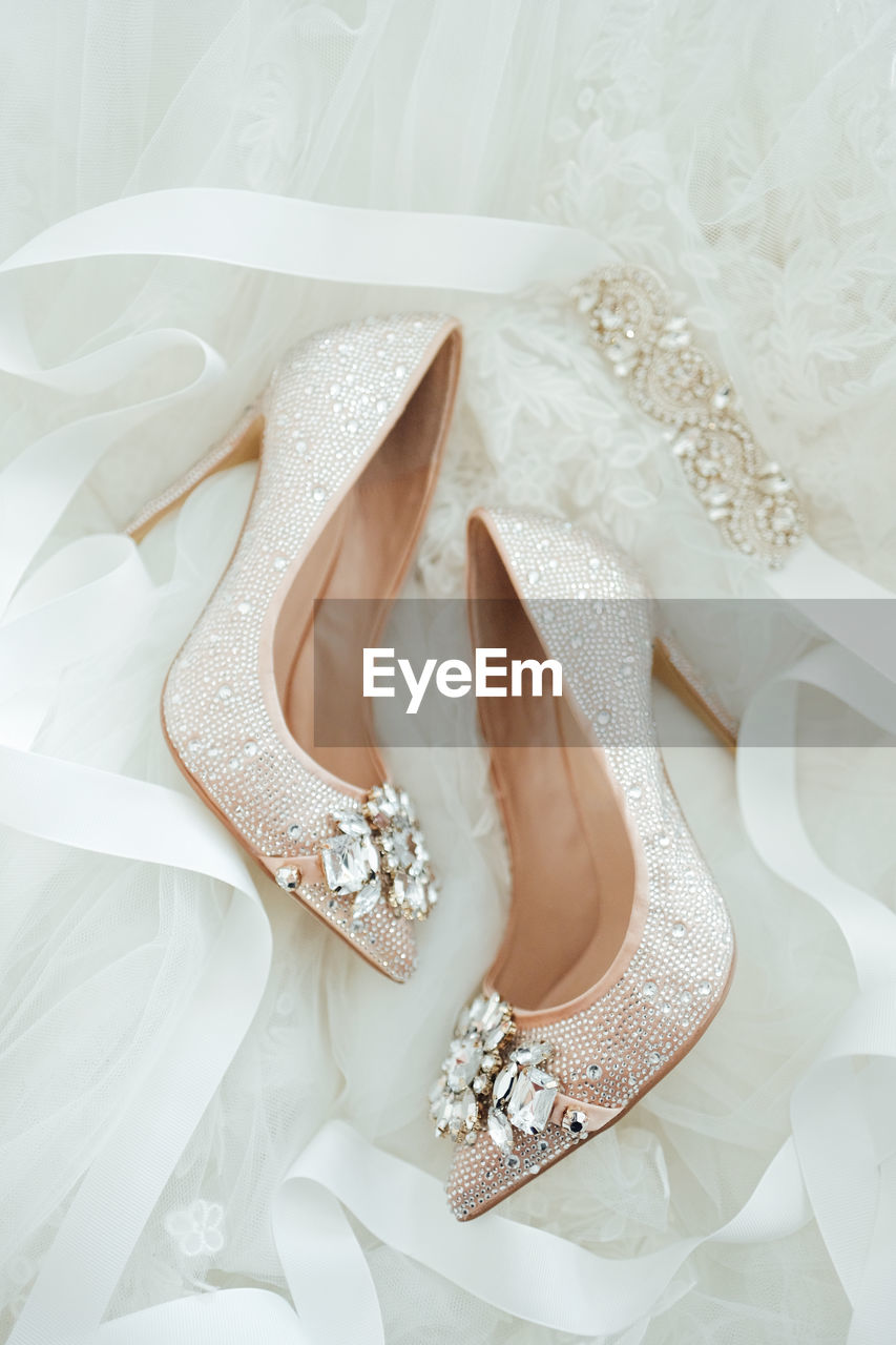 Close-up of bridal shoes dainty beautiful wedding high heels stilletos flatlay details