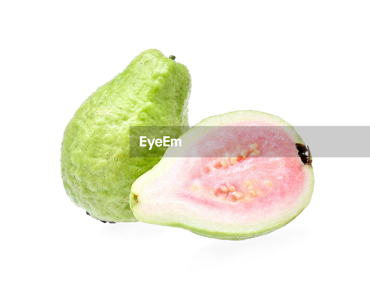 Close-up of guava against white background