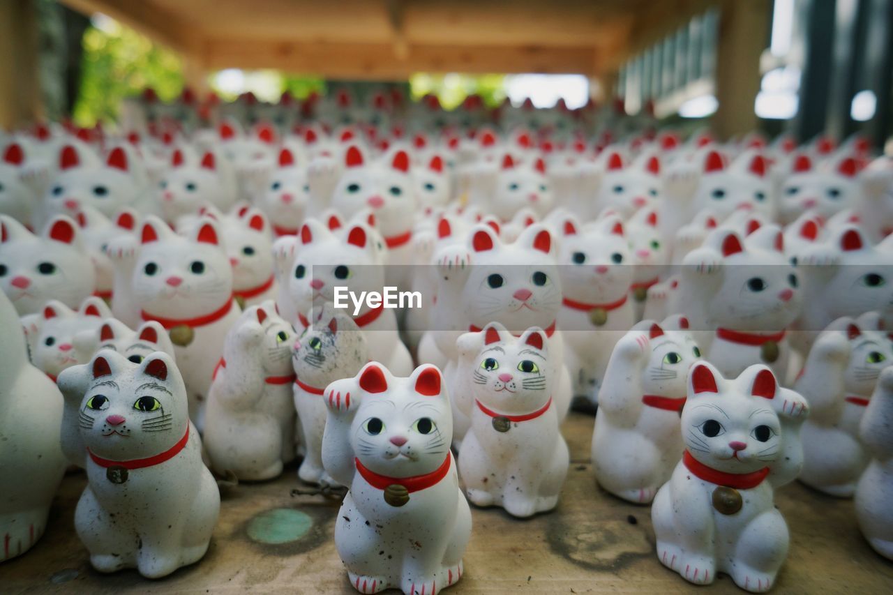 Maneki neko cats at market for sale