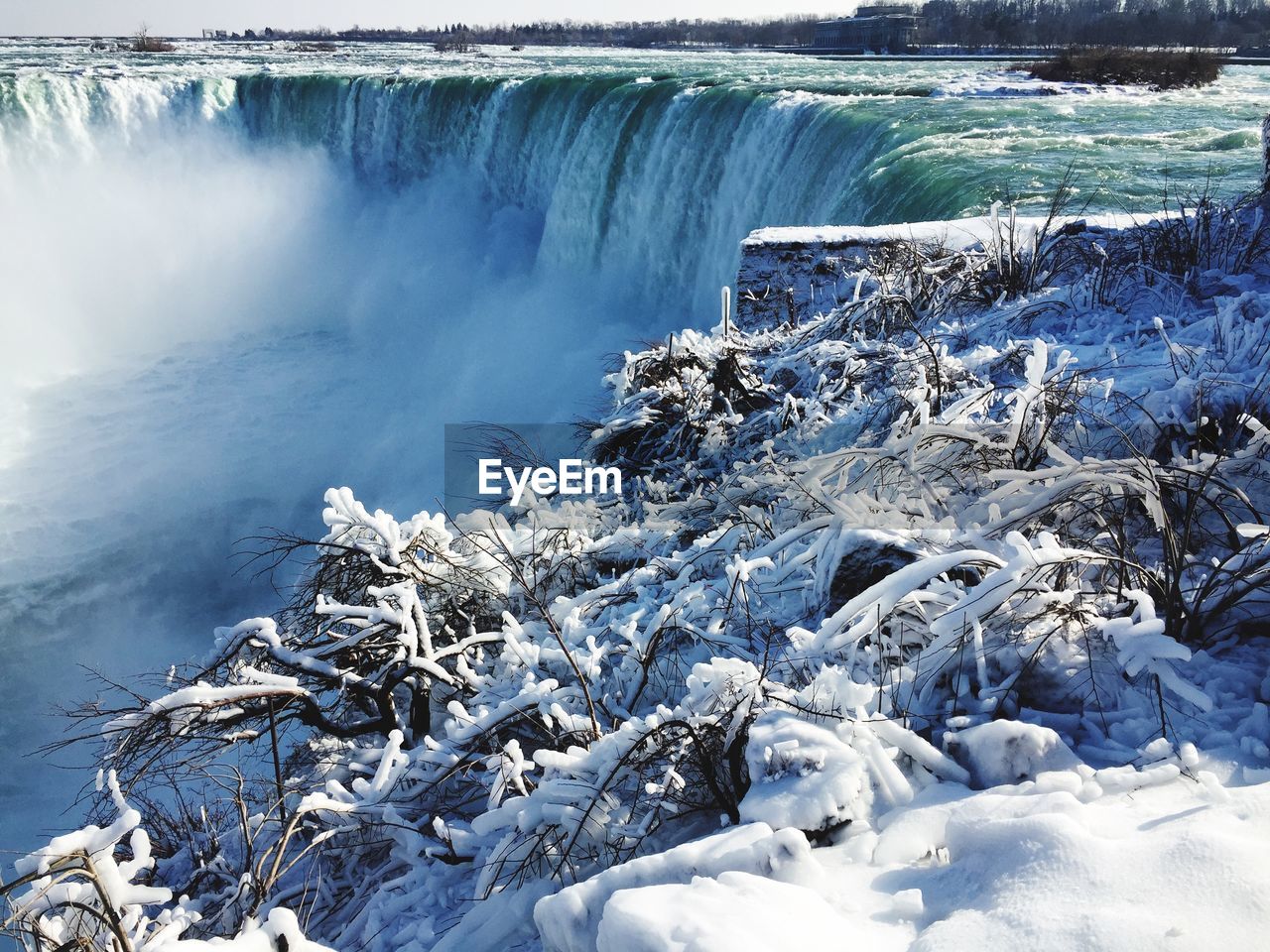 SCENIC VIEW OF LAKE AGAINST SNOW