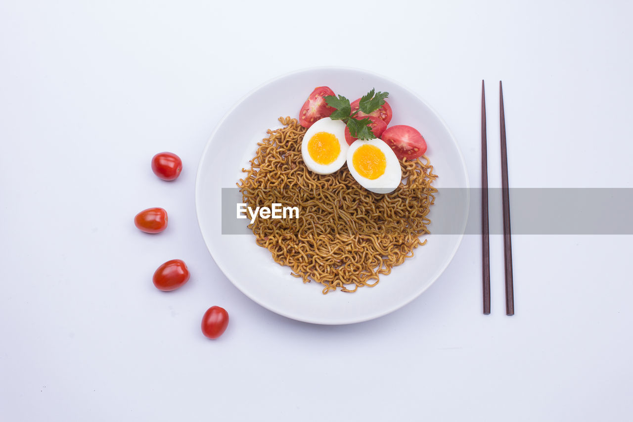 High angle view of breakfast served on white background