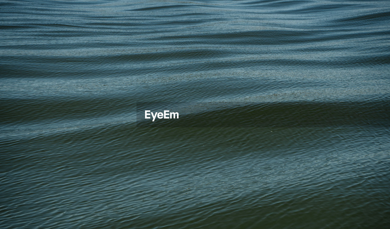 HIGH ANGLE VIEW OF RIPPLED WATER