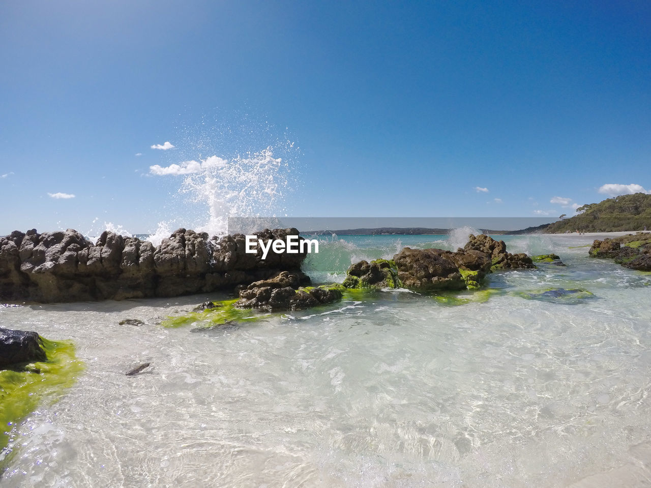 Scenic view of sea against clear blue sky