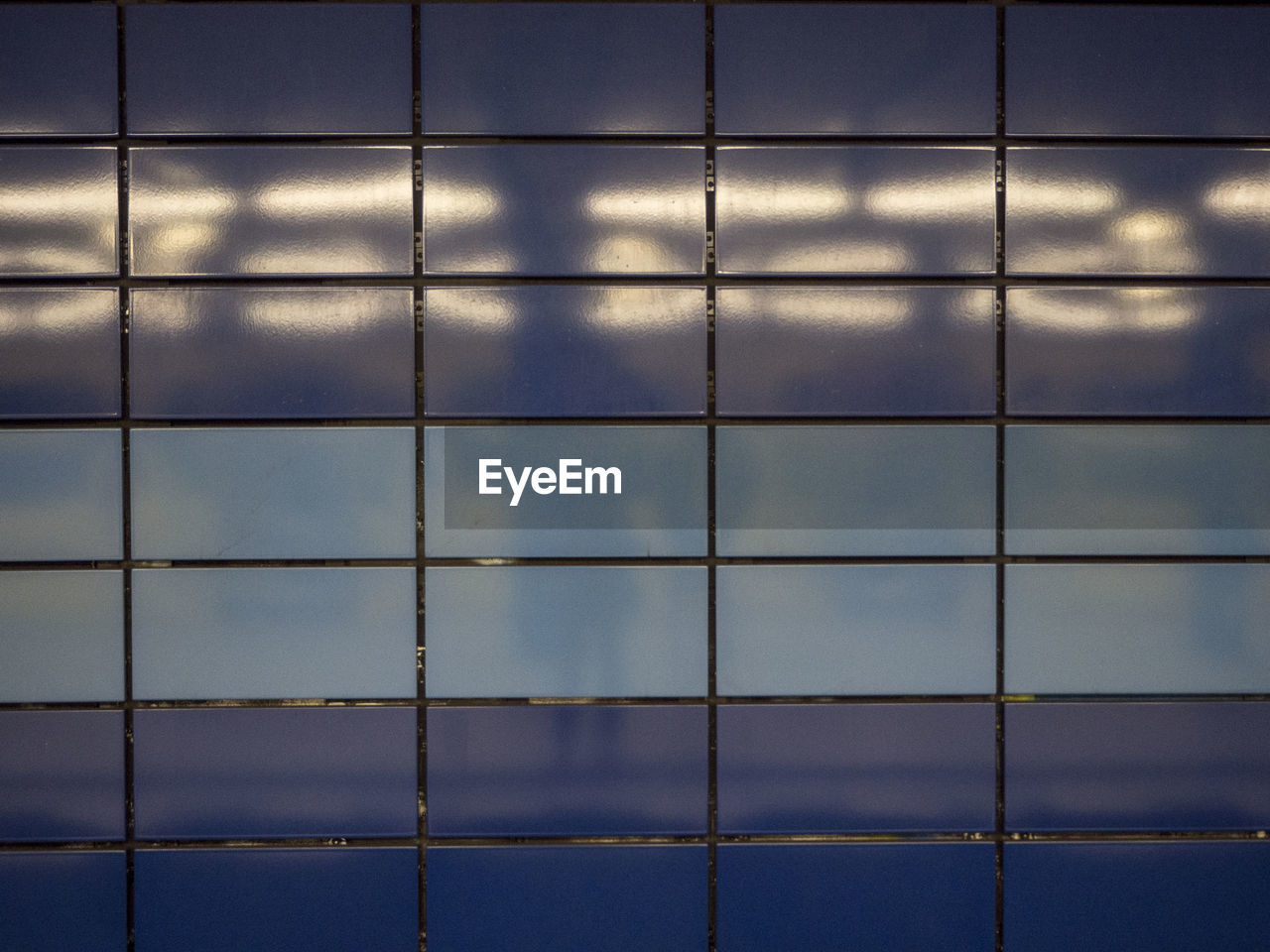 FULL FRAME SHOT OF TILED FLOOR AGAINST SKY