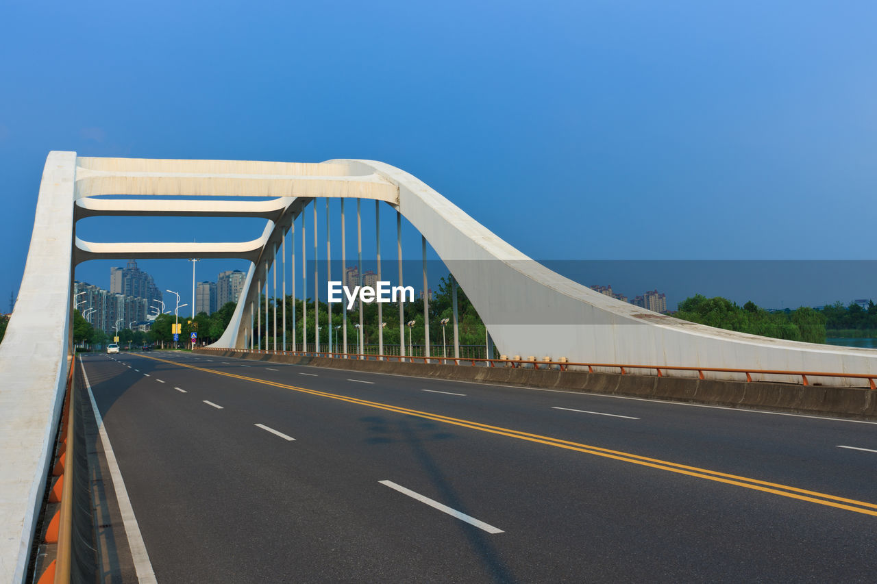 BRIDGE AGAINST BLUE SKY