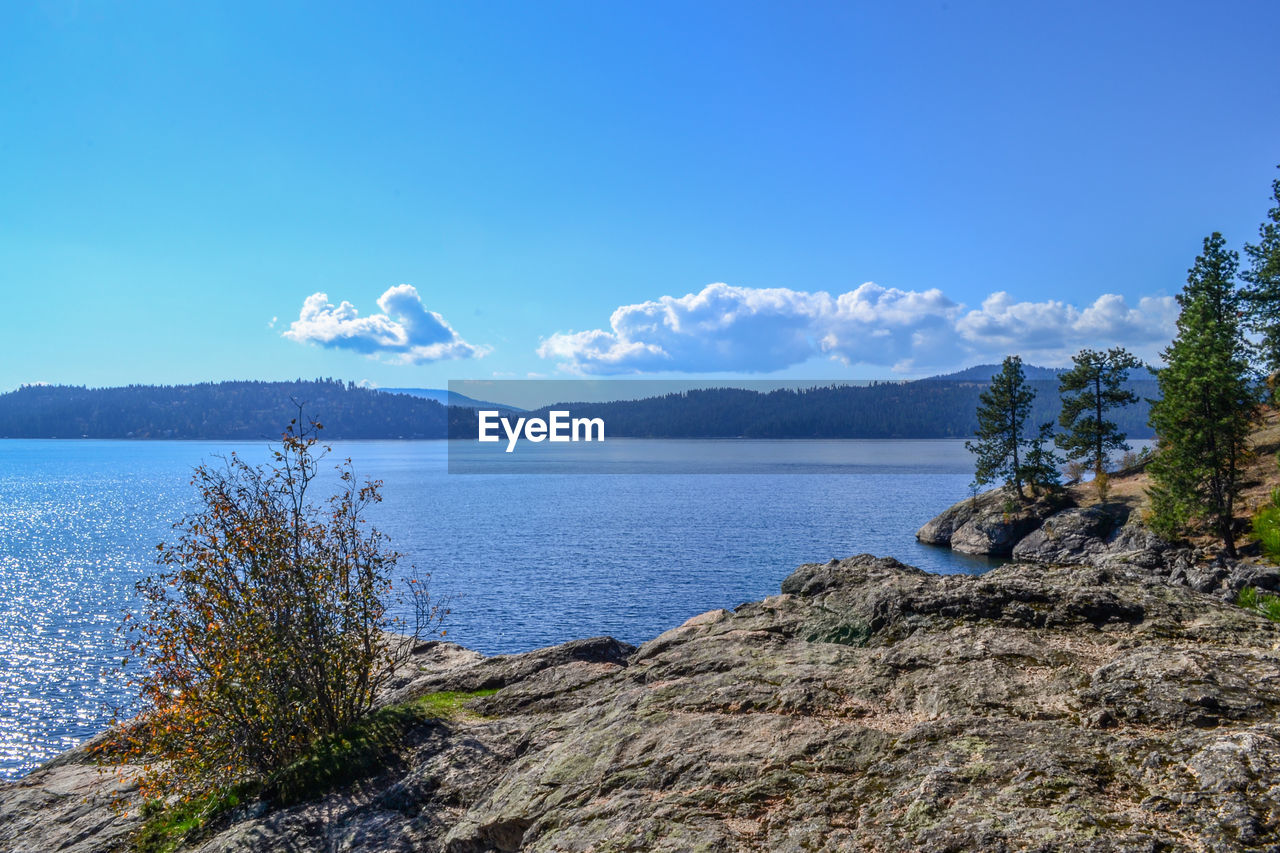 Scenic view of lake against blue sky