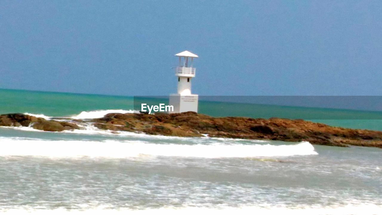 VIEW OF LIGHTHOUSE ON BEACH