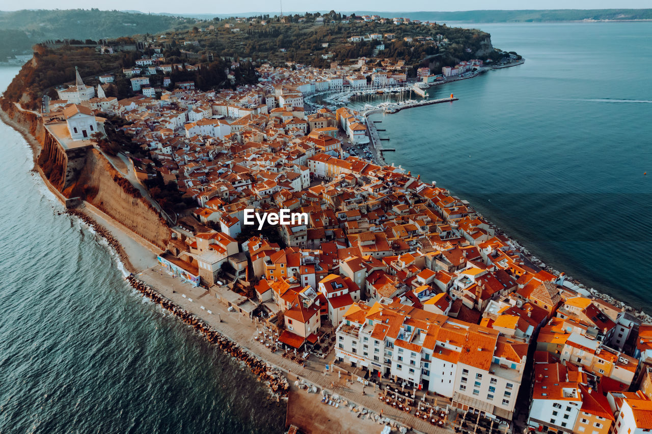 High angle view of cityscape by sea