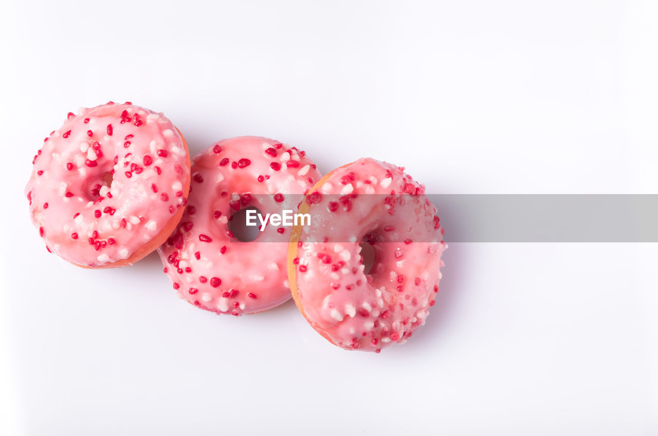 Close-up of donuts against white background