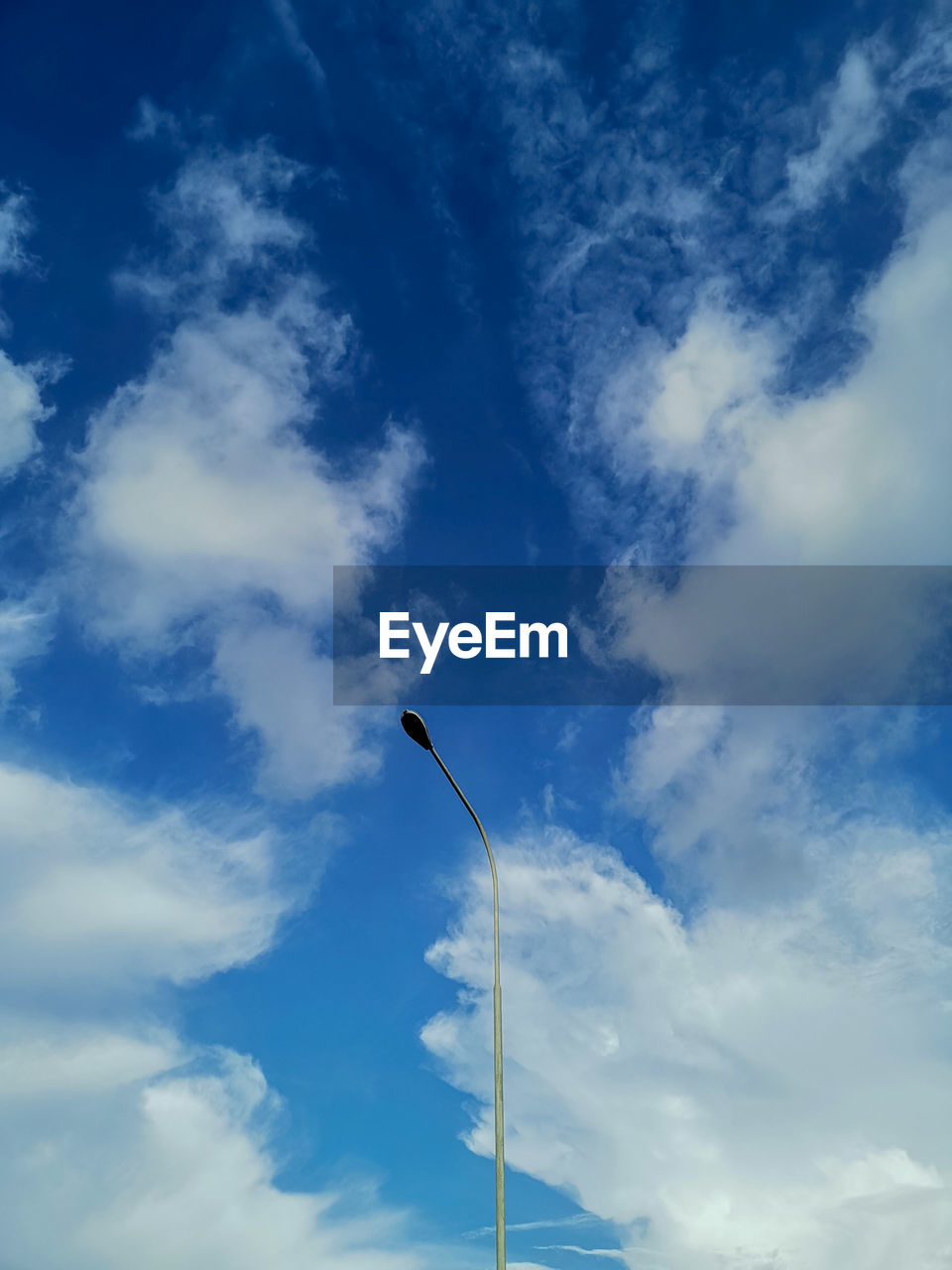 Low angle view of street light against sky