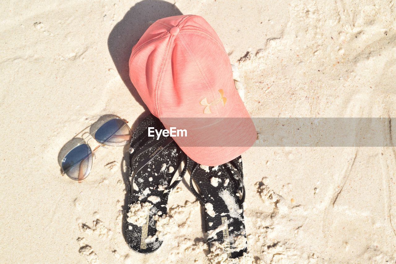 HIGH ANGLE VIEW OF GIRL ON SAND AT BEACH