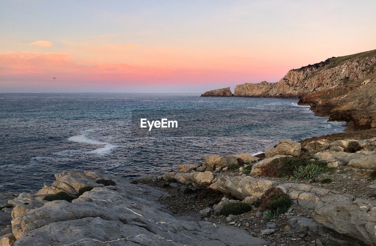 Scenic view of sea at sunset