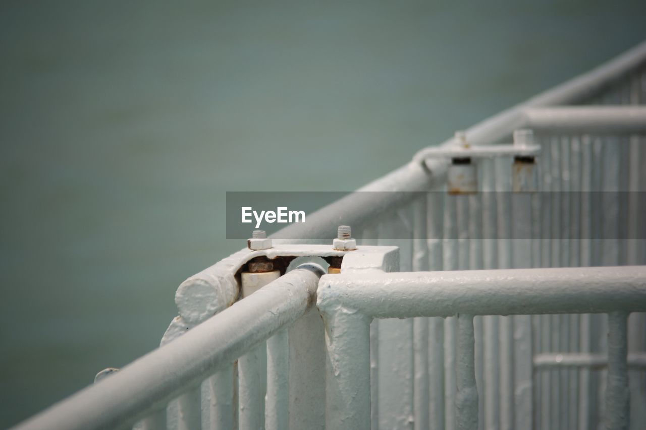 Close-up of white metallic fence