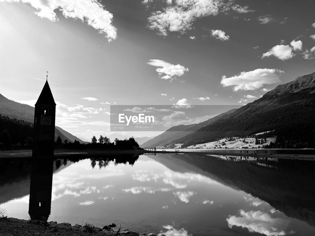 water, black and white, reflection, sky, monochrome photography, monochrome, architecture, nature, cloud, lake, built structure, travel destinations, beauty in nature, scenics - nature, mountain, travel, horizon, landscape, environment, no people, building exterior, tranquility, building, tourism, tranquil scene, religion, outdoors, tower, darkness, bridge, sunlight, morning, transportation