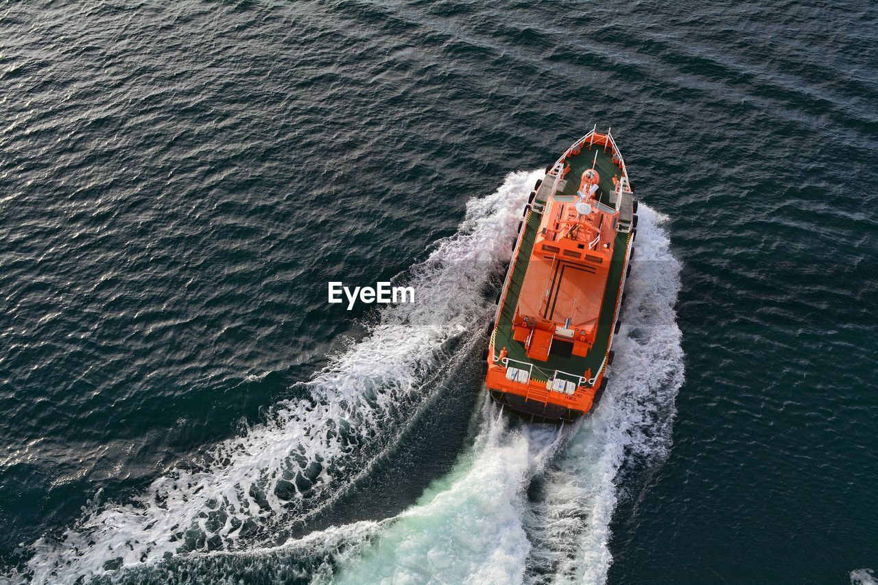 High angle view of boat sailing in sea