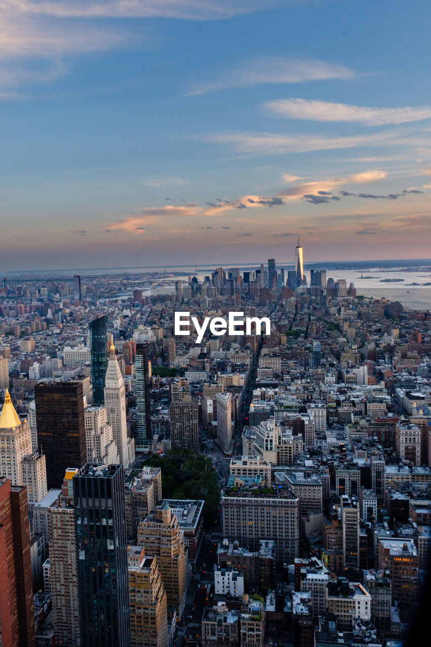 High angle view of city buildings against sky