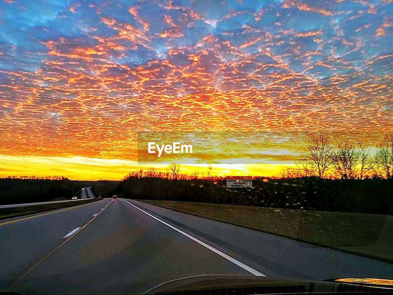 VIEW OF ROAD AT SUNSET