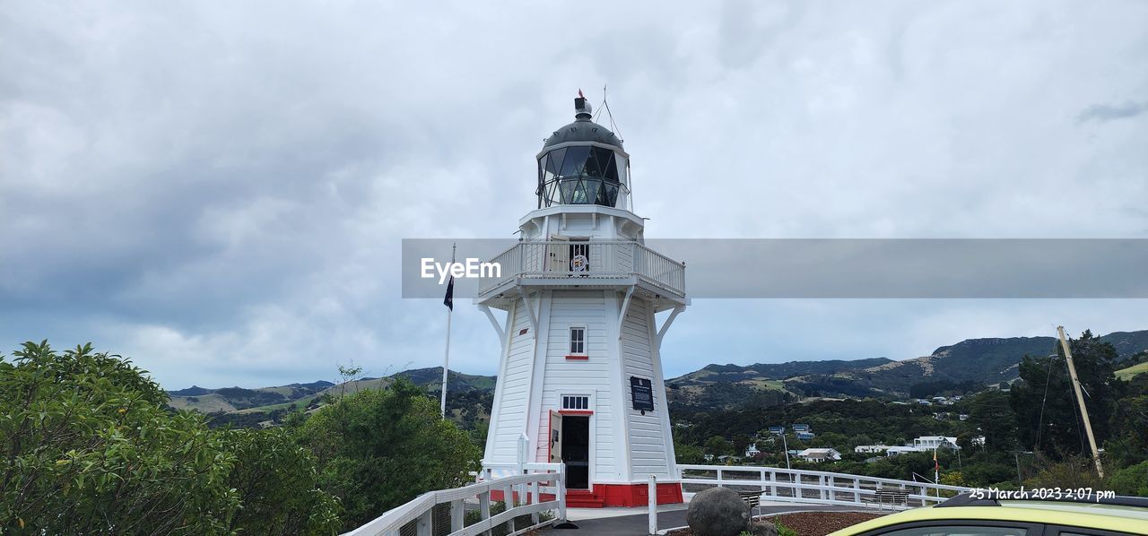 architecture, built structure, tower, sky, cloud, building exterior, lighthouse, nature, building, travel destinations, travel, guidance, no people, landmark, water, transportation, tree, day, security, outdoors, protection, plant, environment, tourism, history, observation tower, the past, land, mountain, landscape, scenics - nature, beauty in nature