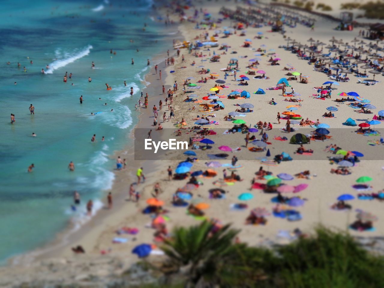 HIGH ANGLE VIEW OF PEOPLE ENJOYING AT BEACH