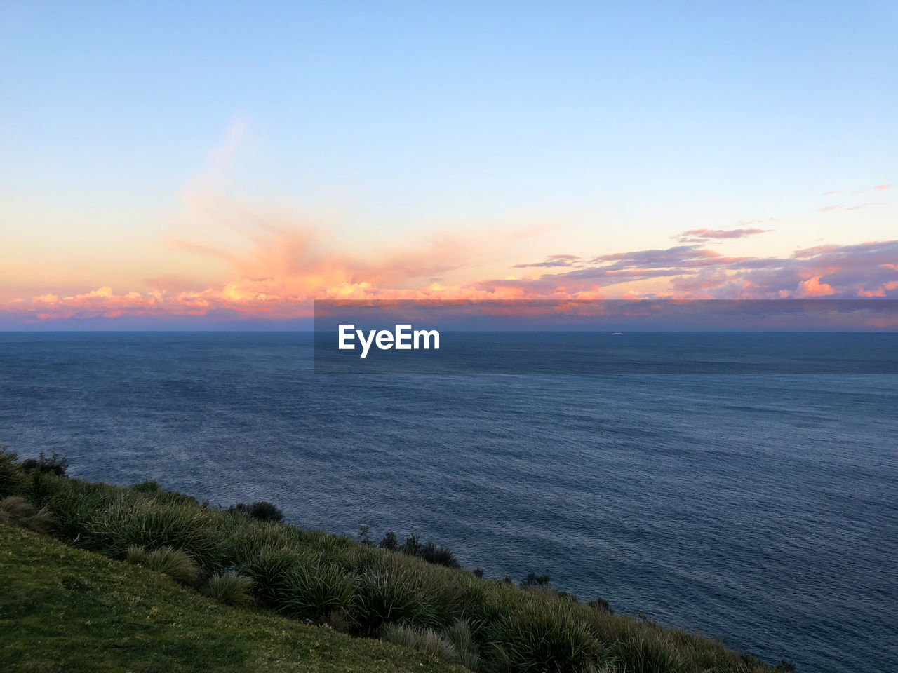 SCENIC VIEW OF SEA DURING SUNSET