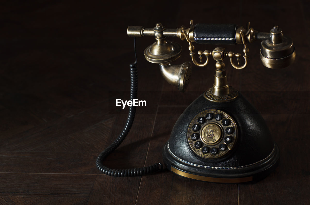 Close-up of old-fashioned telephone on table