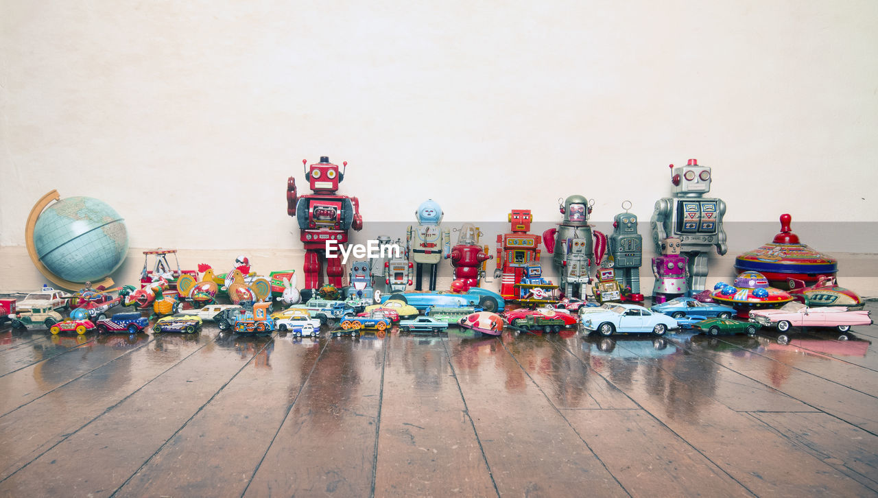 TOYS ON TABLE AGAINST WALL