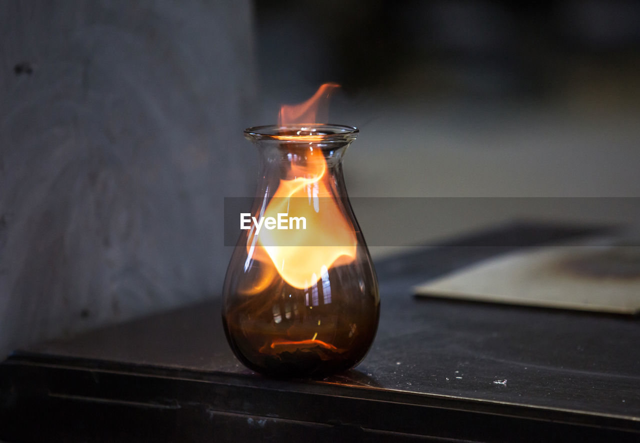 Close up of flame in jar