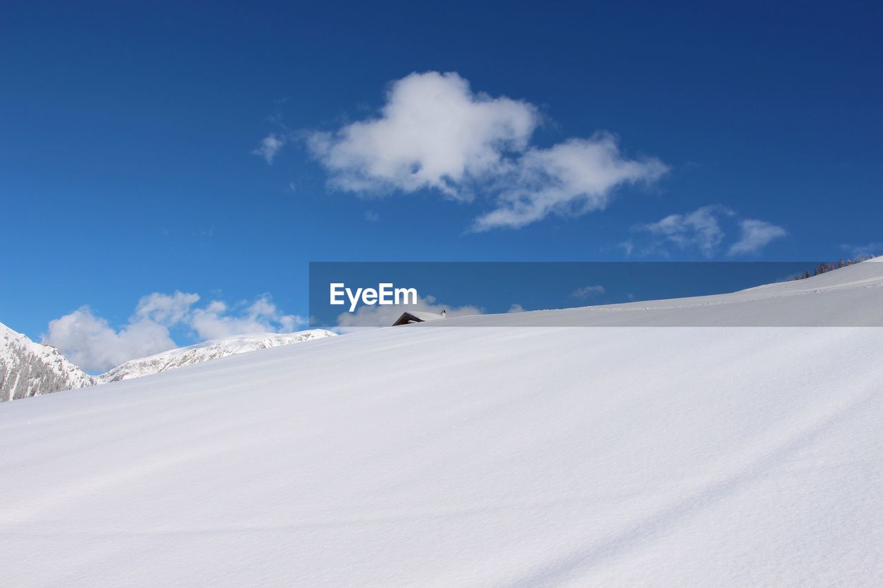 Scenic view of desert against sky during winter