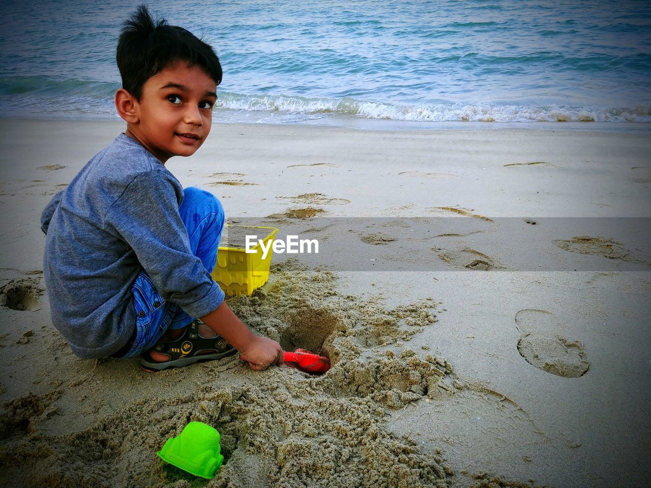 Cute boy playing at beach