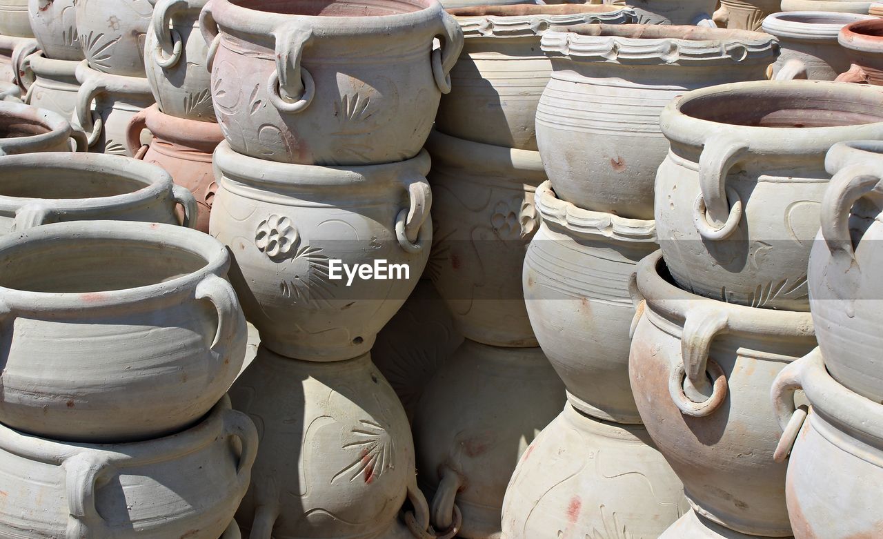 Close-up of terracotta pots during sunny day